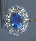 Antique Sapphire And Diamond Cluster Engagement Ring. Antique Sapphire And Diamond Cluster Engagement Ring.